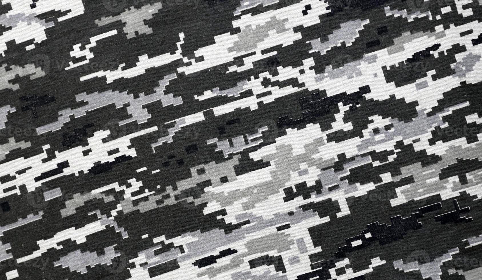 Fabric with texture of Ukrainian military pixeled camouflage. Cloth with camo pattern in grey, brown and green pixel shapes. Official uniform of Ukrainian soldiers photo