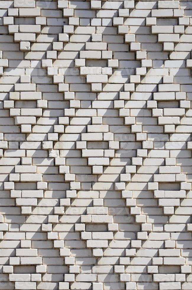 A pattern made of white bricks in the form of diamond shapes. Decoration of the walls during the Soviet Union photo