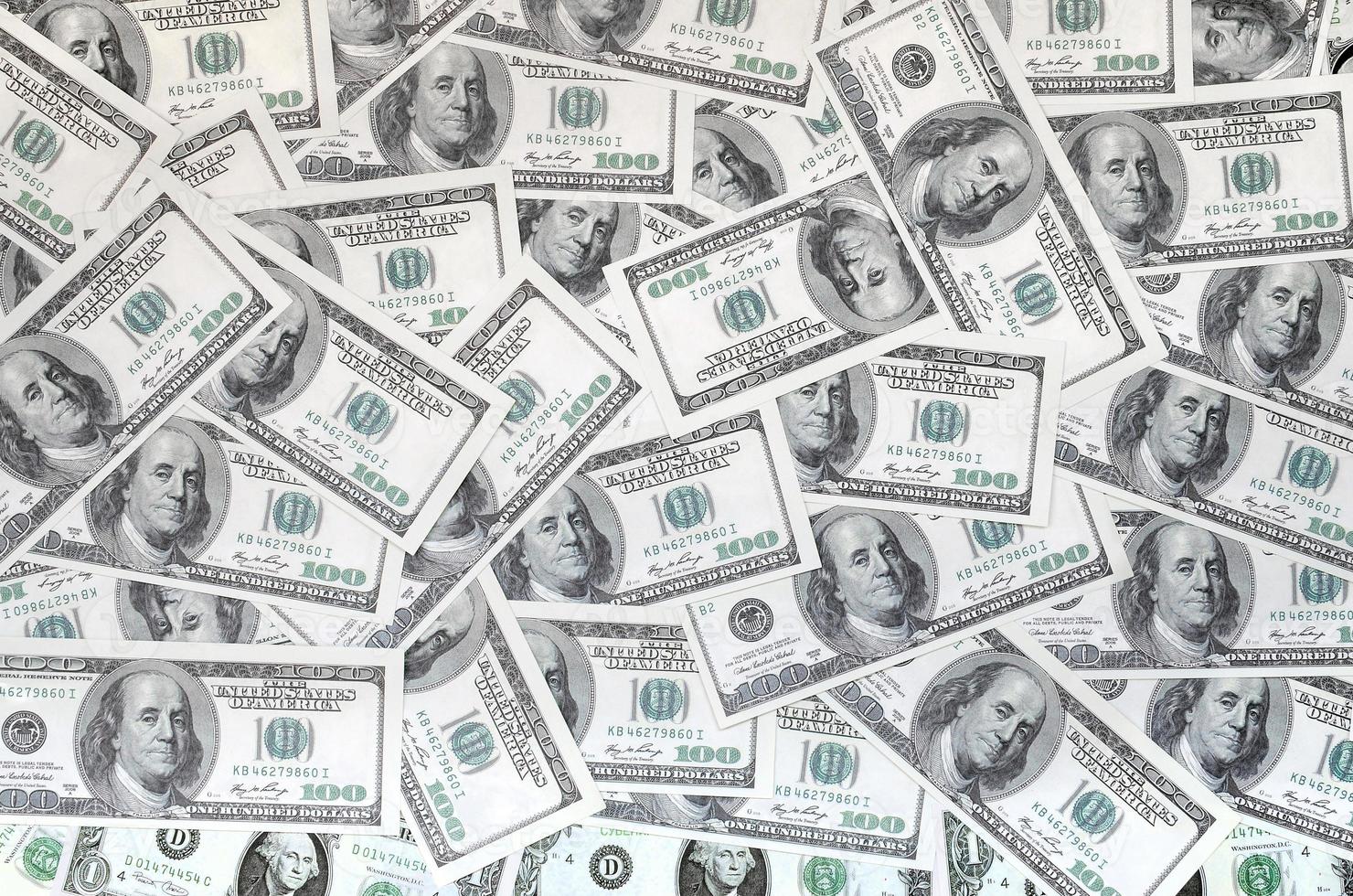 A pattern of many dollar bills. Background image photo