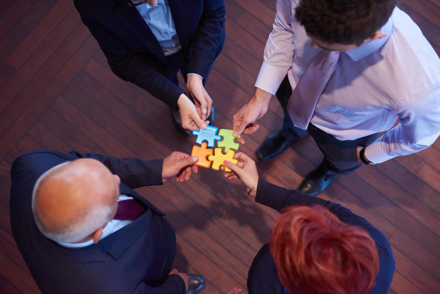 assembling jigsaw puzzle photo