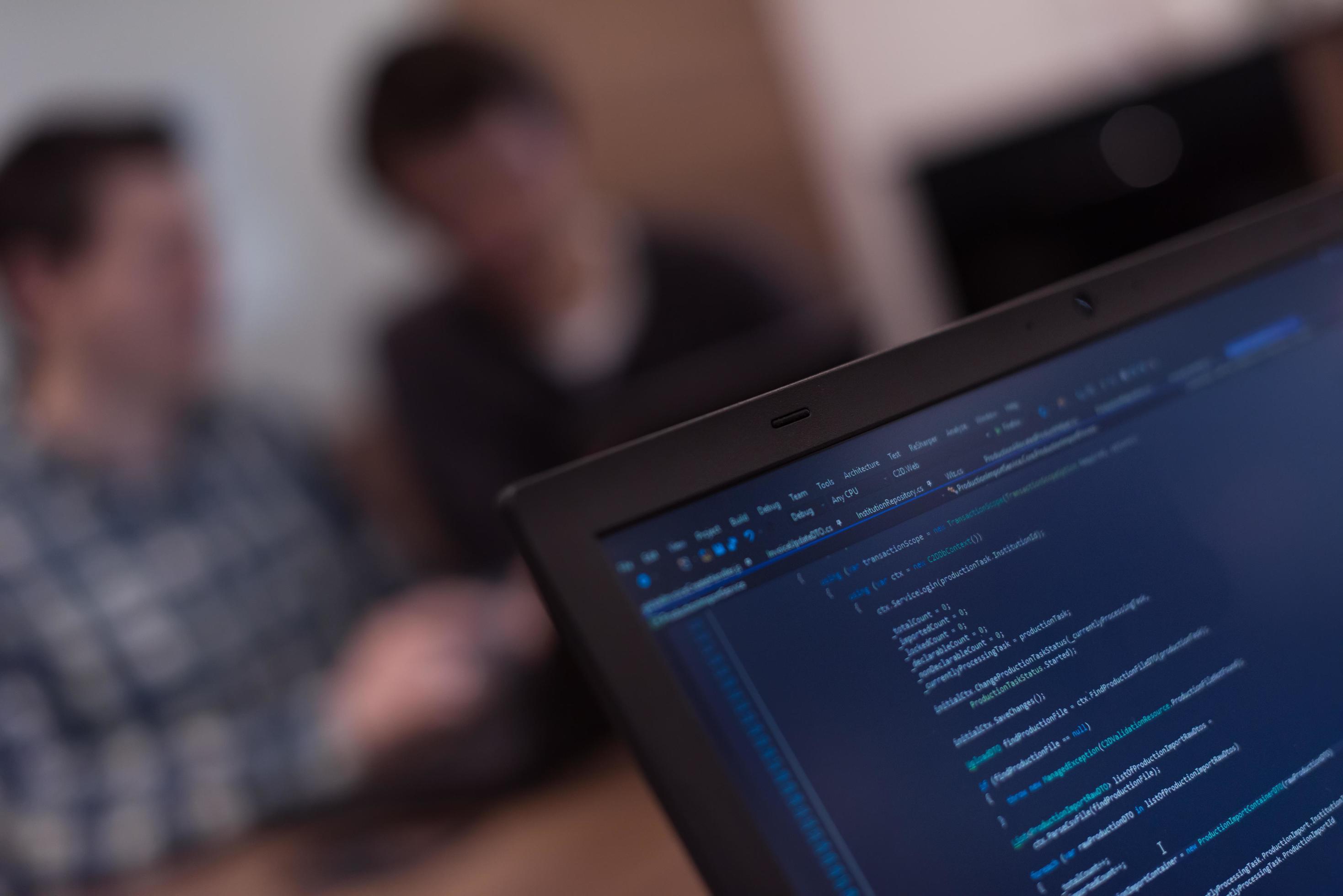 Writing programming code on laptop 12486469 Stock Photo at Vecteezy