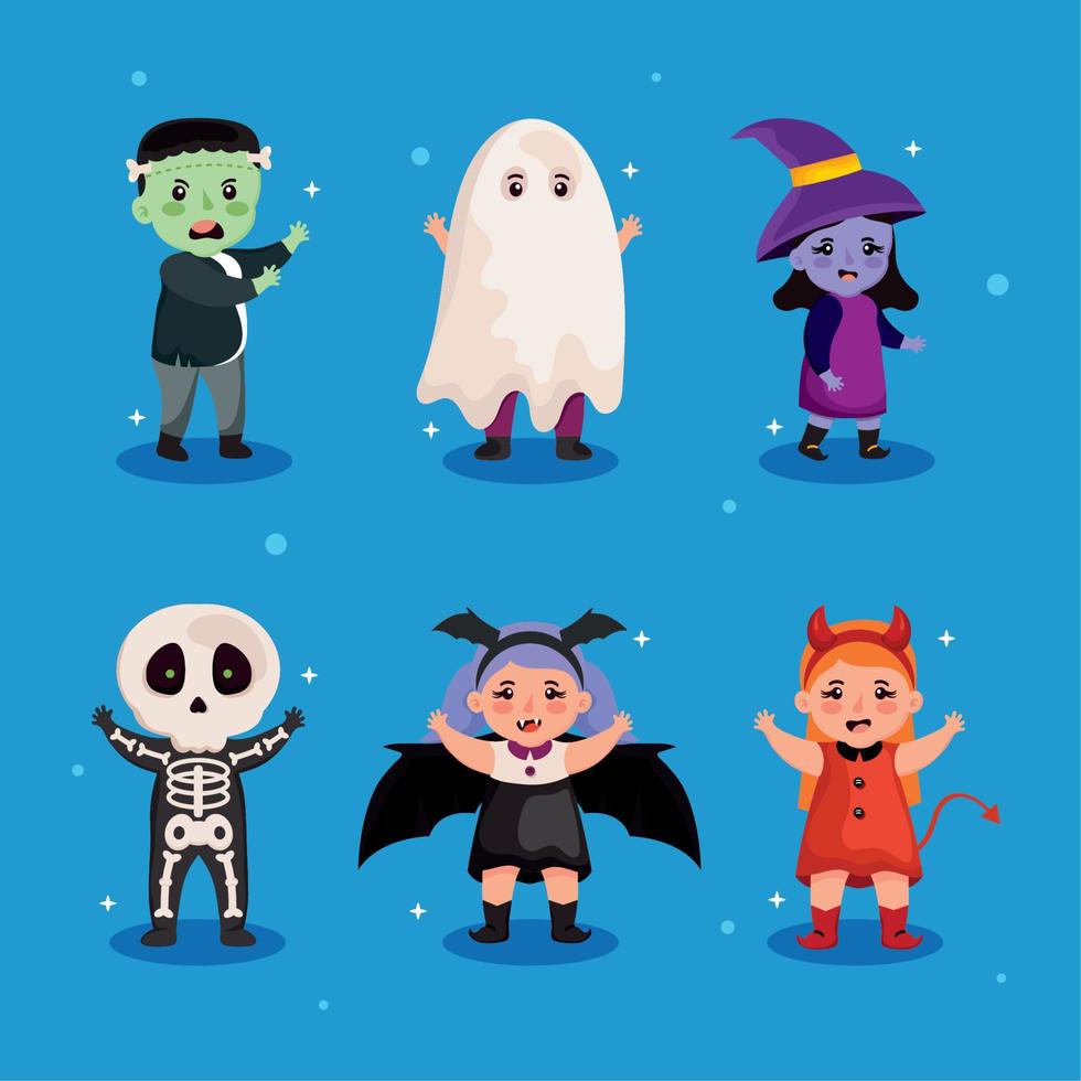 seis niños con disfraces de halloween vector