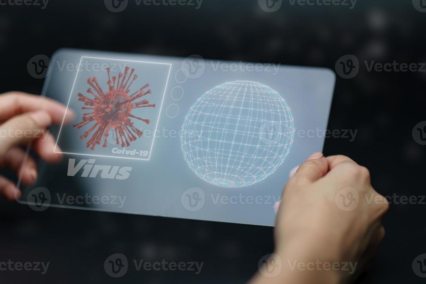 Hand holding and showing virus on tablet device. photo