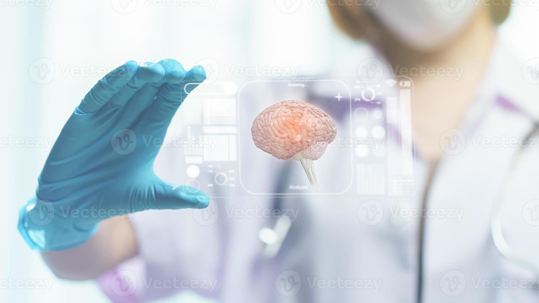 Doctor hand hold transparent tablet display showing brain in screen photo