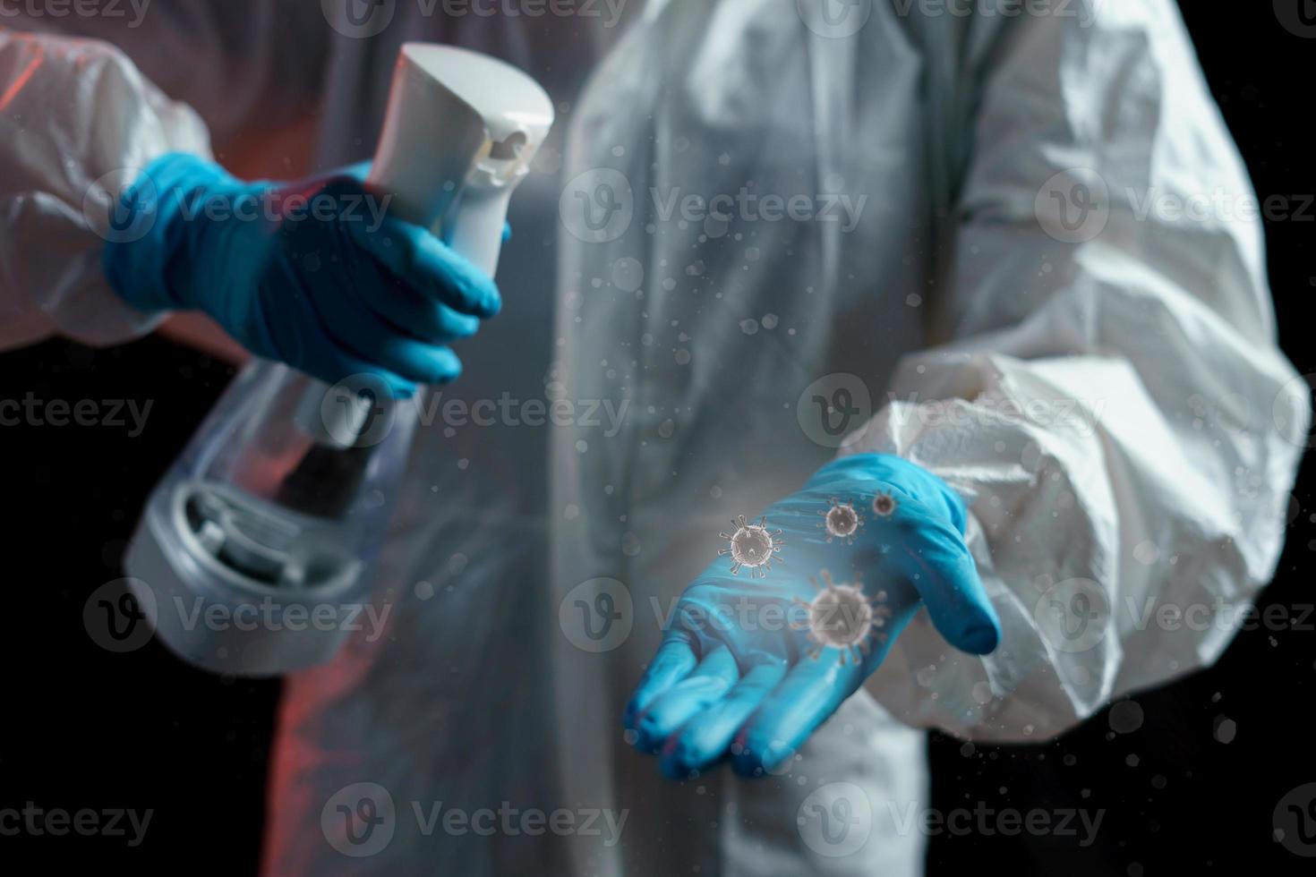 Hand using sanitizer spray, alcohol spraying disinfectant to stop spreading  Virus, bacteria or COVID-19. PPE suit photo