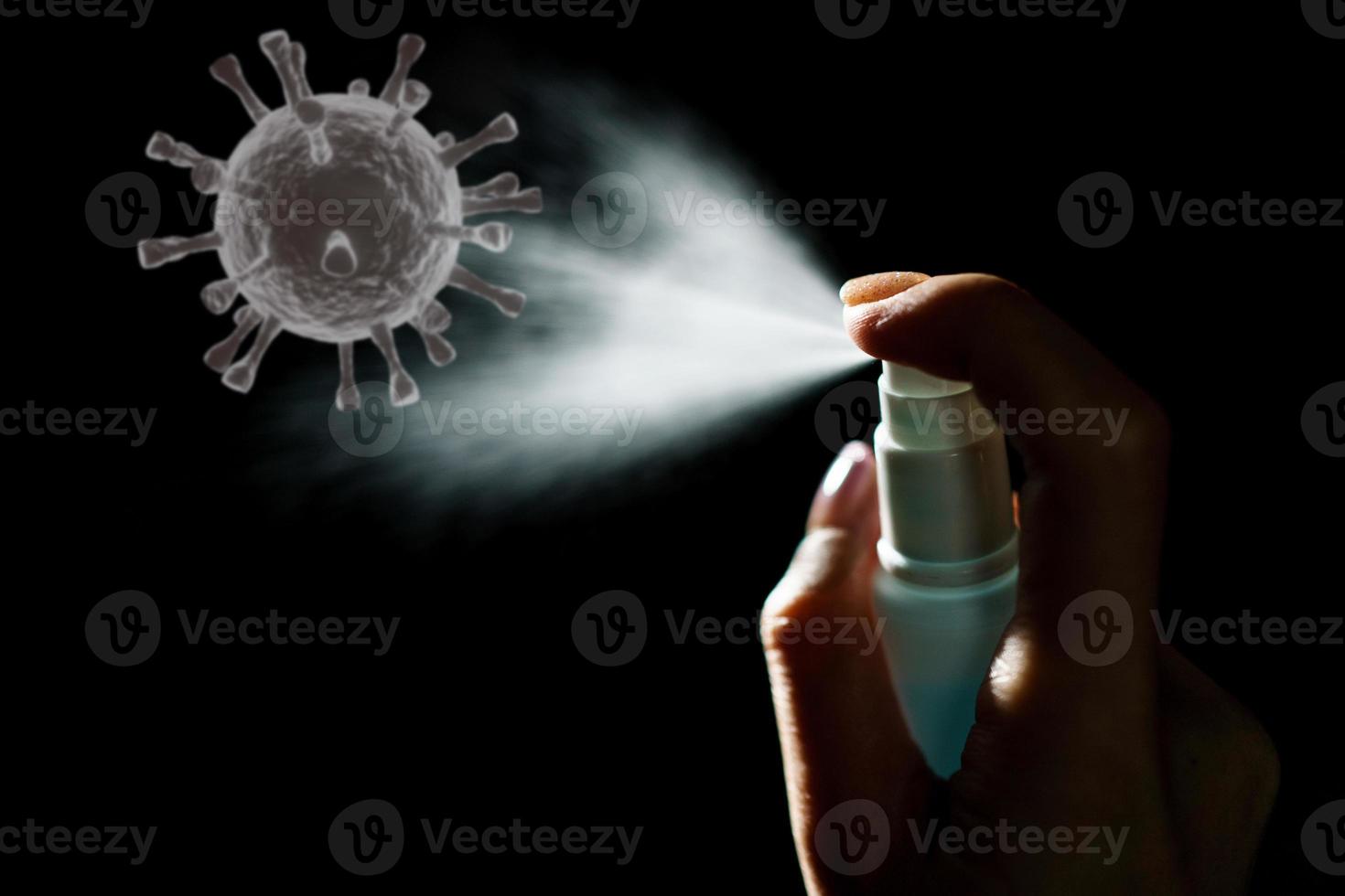 Hand using sanitizer spray, alcohol spraying disinfectant to stop spreading  coronavirus or COVID-19. photo