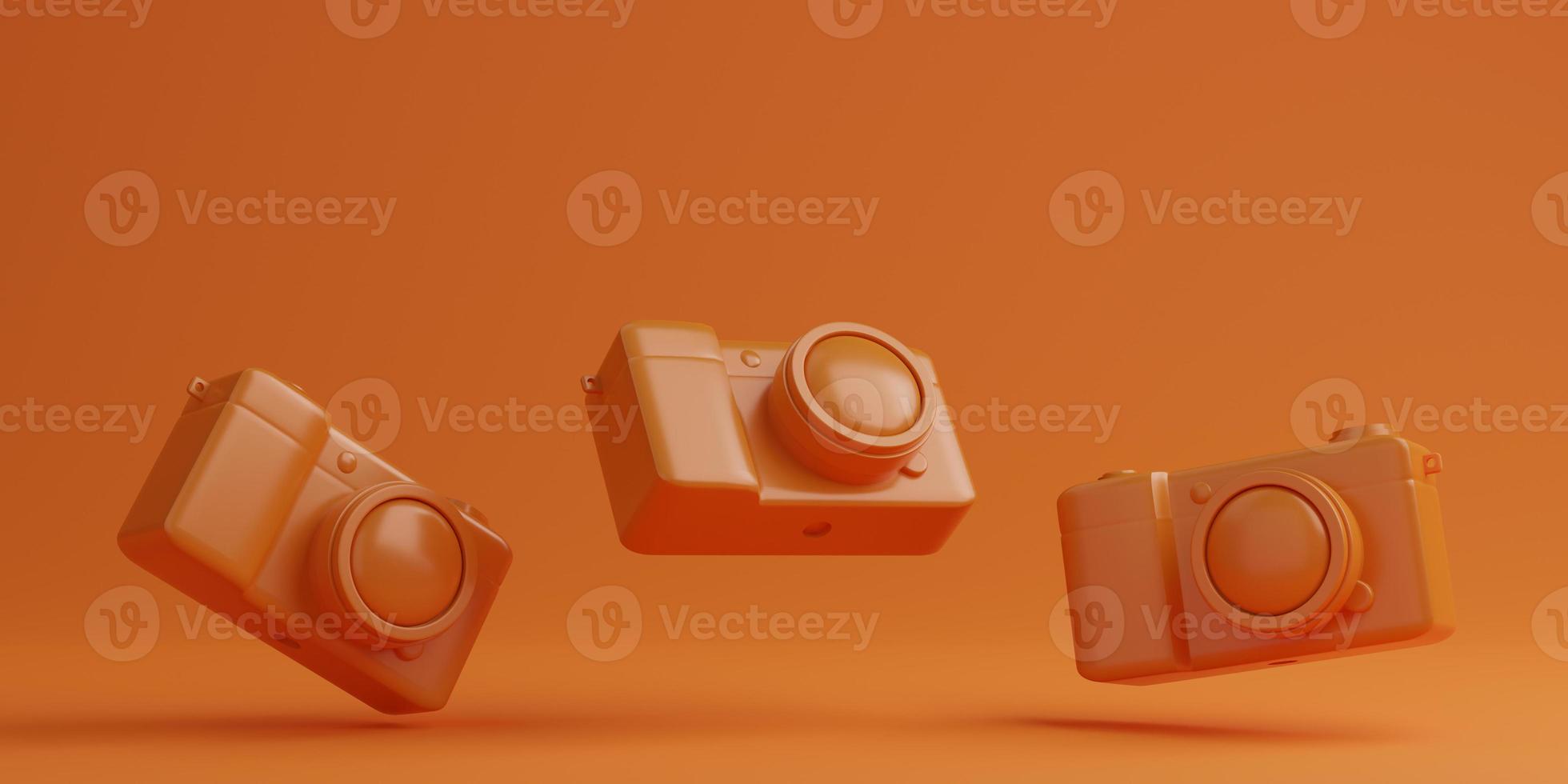 Orange digital camera on orange background, technology concept. 3d rendering photo