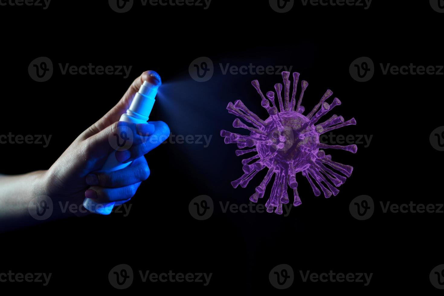 Hand using sanitizer spray, alcohol spraying disinfectant to stop spreading  coronavirus or COVID-19. photo