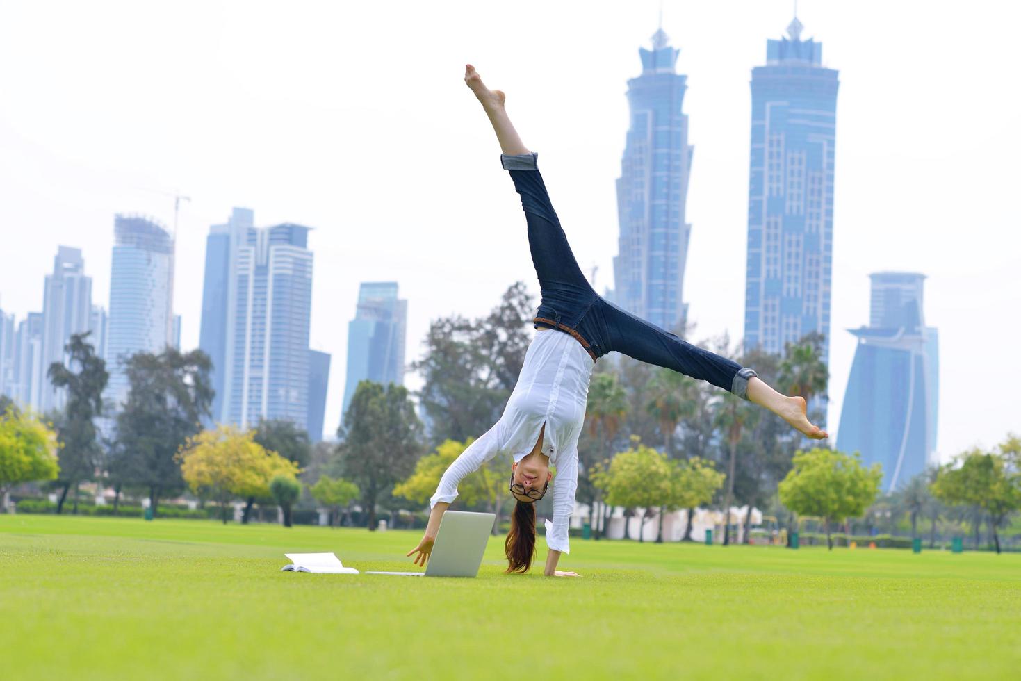 woman with laptop in park photo