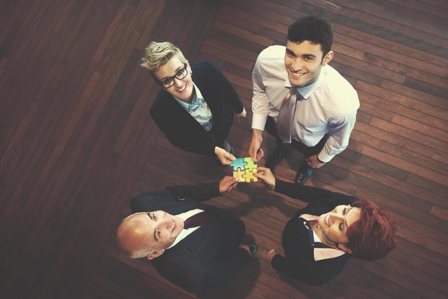 assembling jigsaw puzzle 12492106 Stock Photo at Vecteezy