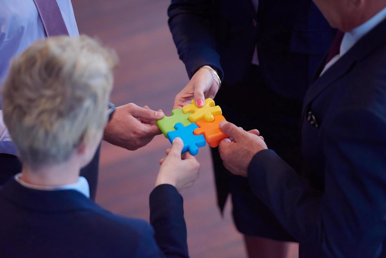 assembling jigsaw puzzle photo