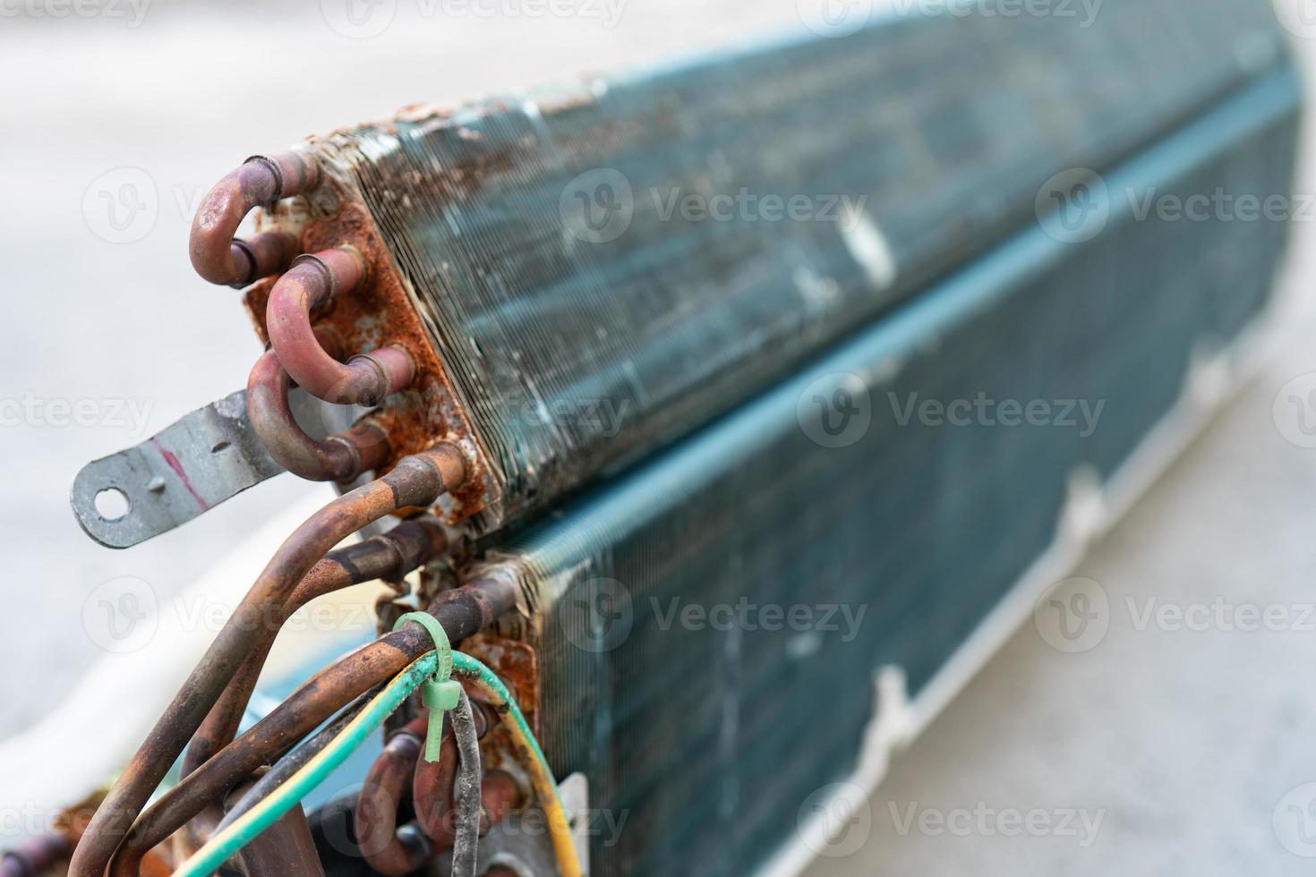 Close up old coil cooler of air conditioner photo