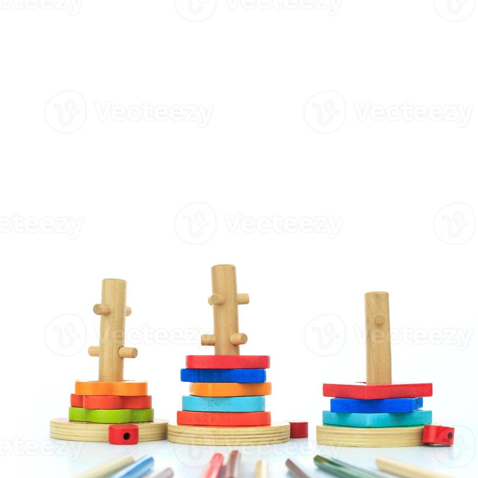 colorful wooden toys on a white background photo