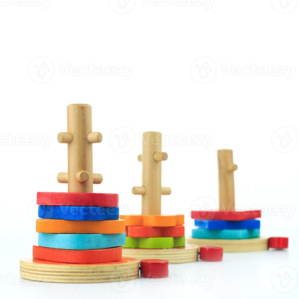 colorful wooden toys on a white background photo