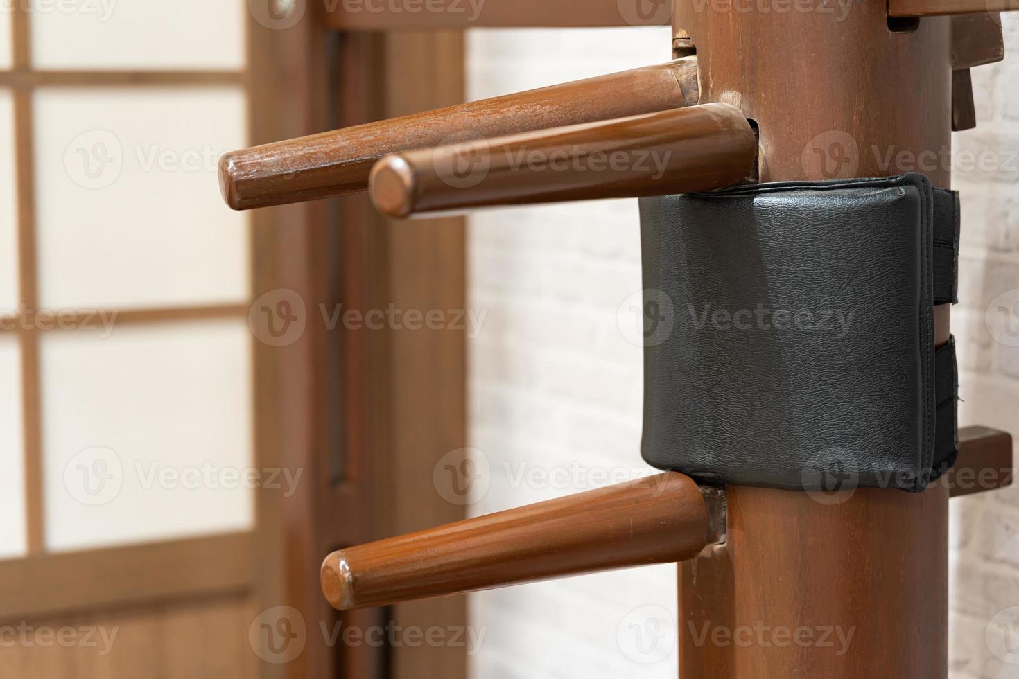 Wing Chun Wooden Dummy. Chinese kung fu practice dummy tool photo