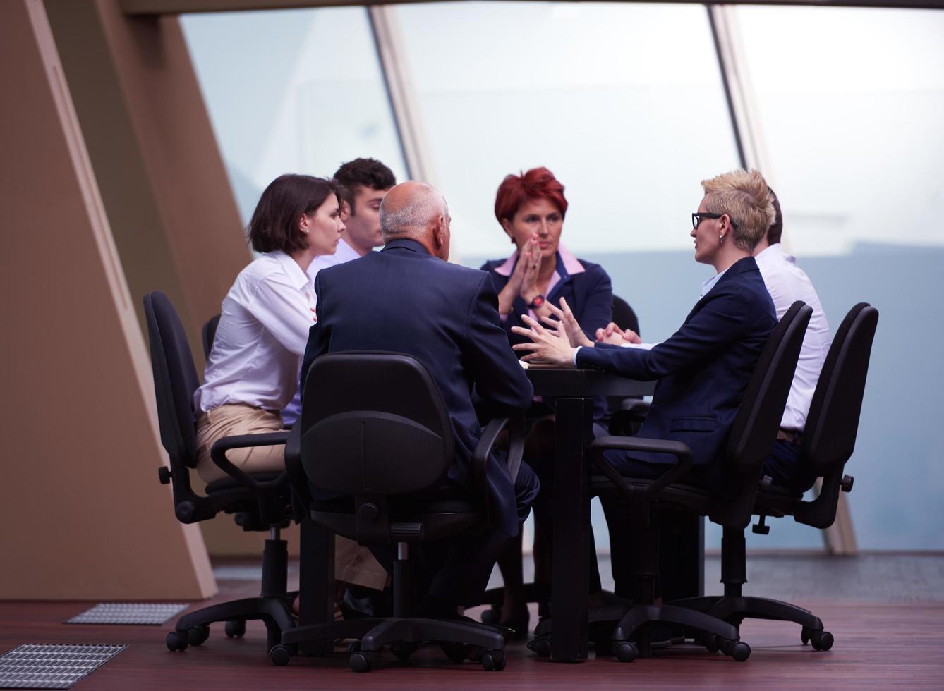 business people group on meeting at modern bright office photo
