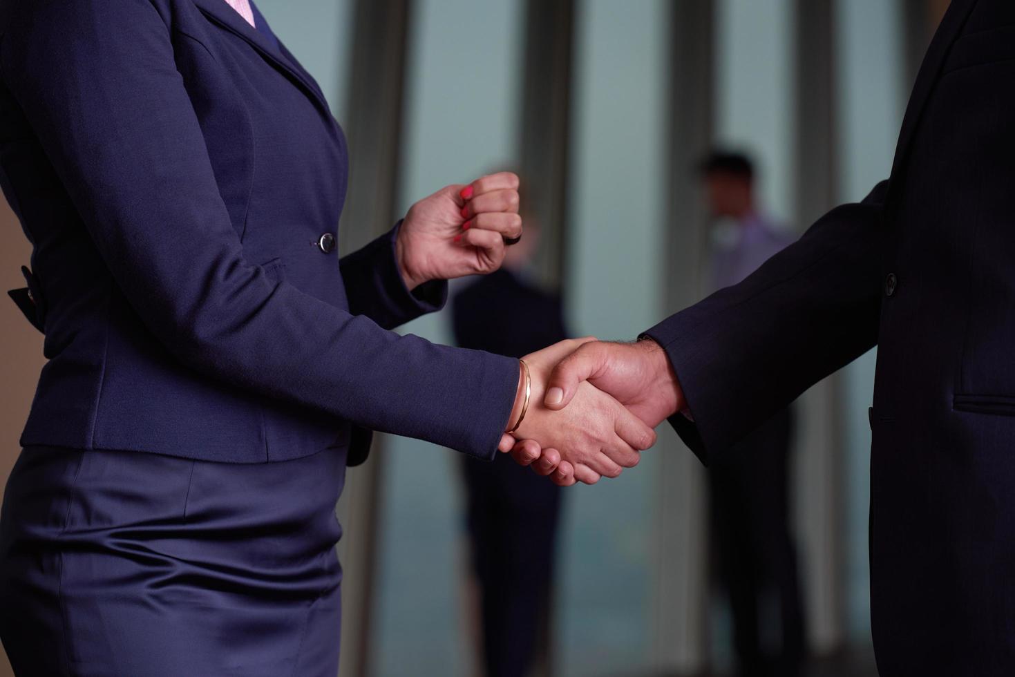 handshake of business woman and man photo