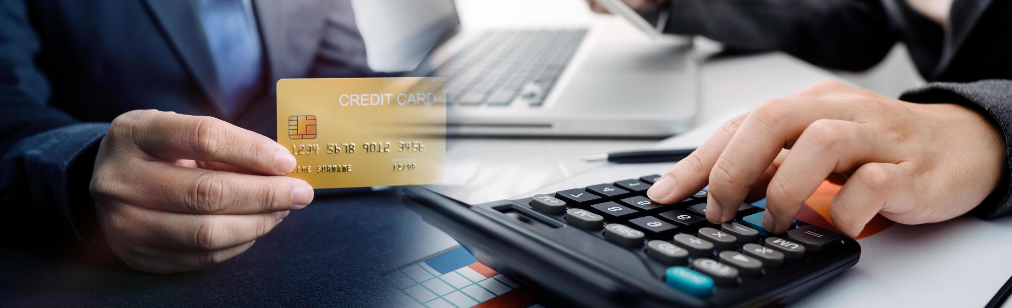 technology, people and online shopping concept - happy smiling man with tablet pc computer and credit card at home photo