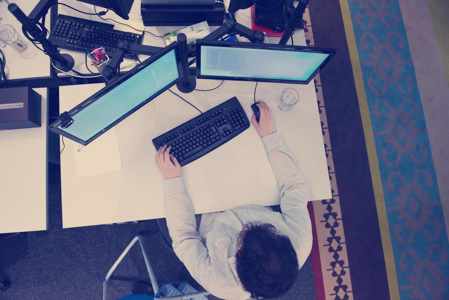 young programmer writing programming code top view photo