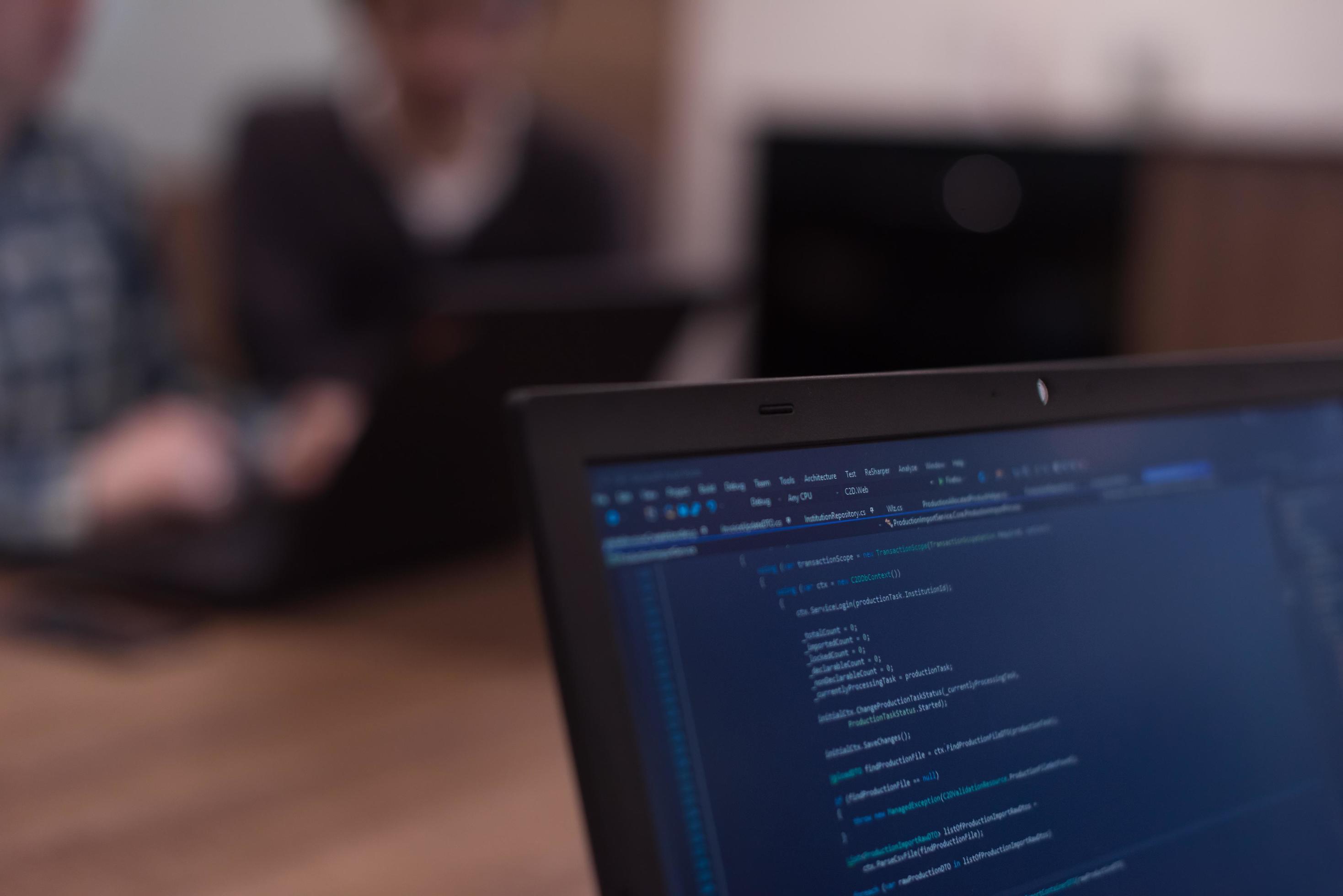 Writing programming code on laptop 12500616 Stock Photo at Vecteezy