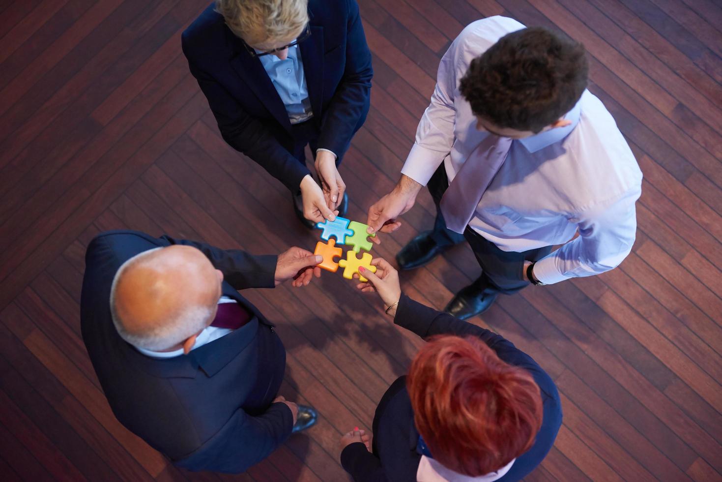 assembling jigsaw puzzle 12501031 Stock Photo at Vecteezy