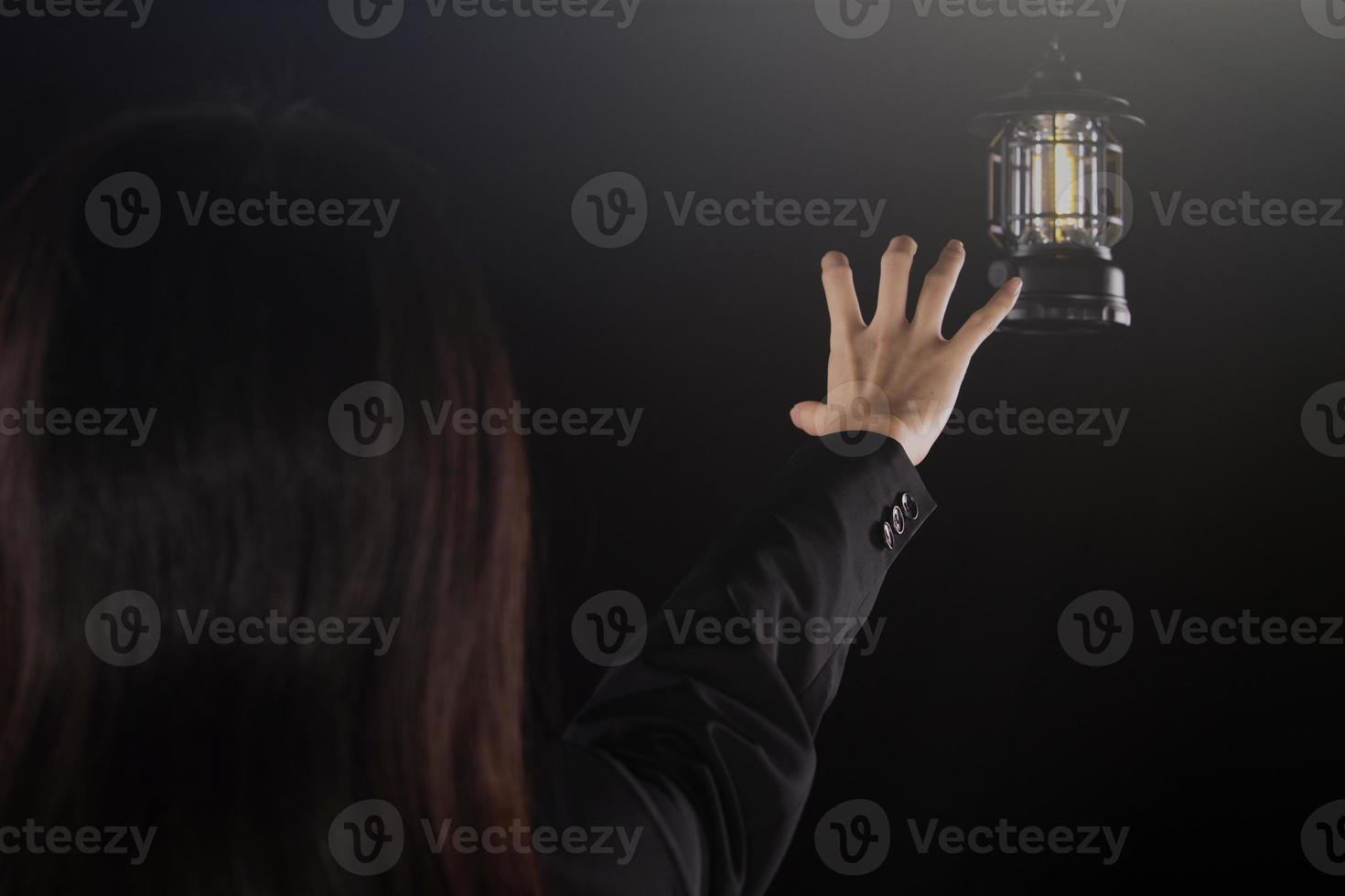 Depressed sad business woman looking and grab light lamp, feeling lonely tired and worried suffering depression in mental health, loneliness and isolation concept. Low key copy space photo