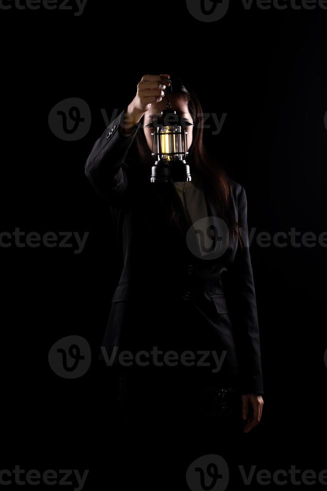 Business Woman hold light lamp lantern as lead the way out of problem, idea solution creativity inspire innovation success glowing your imagination invention. Concept Vision exit, copy space photo