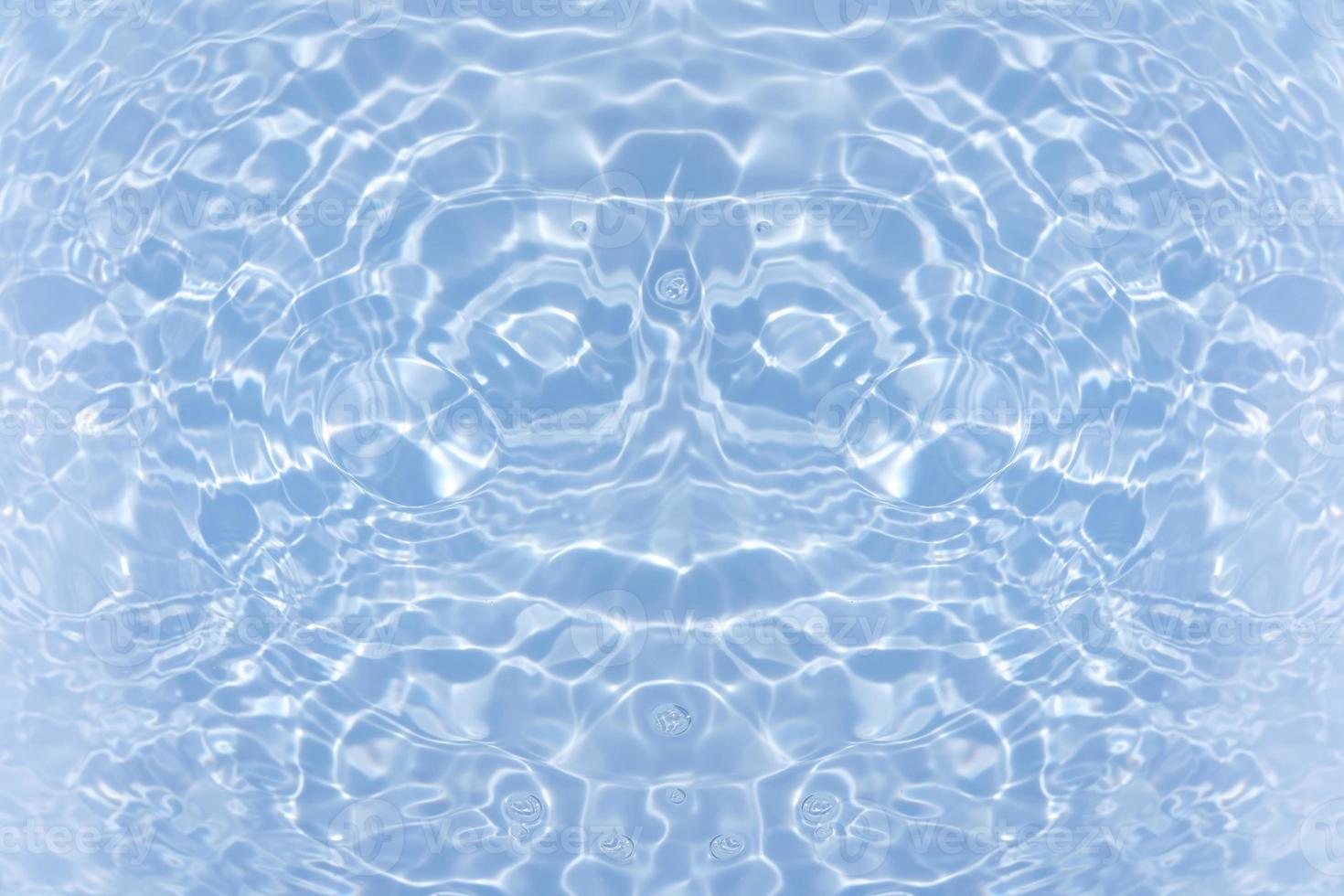 Defocus blurred transparent blue colored clear calm water surface texture with splash, bubble. Shining blue water ripple background. Surface of water in swimming pool. Blue bubble water shining. photo