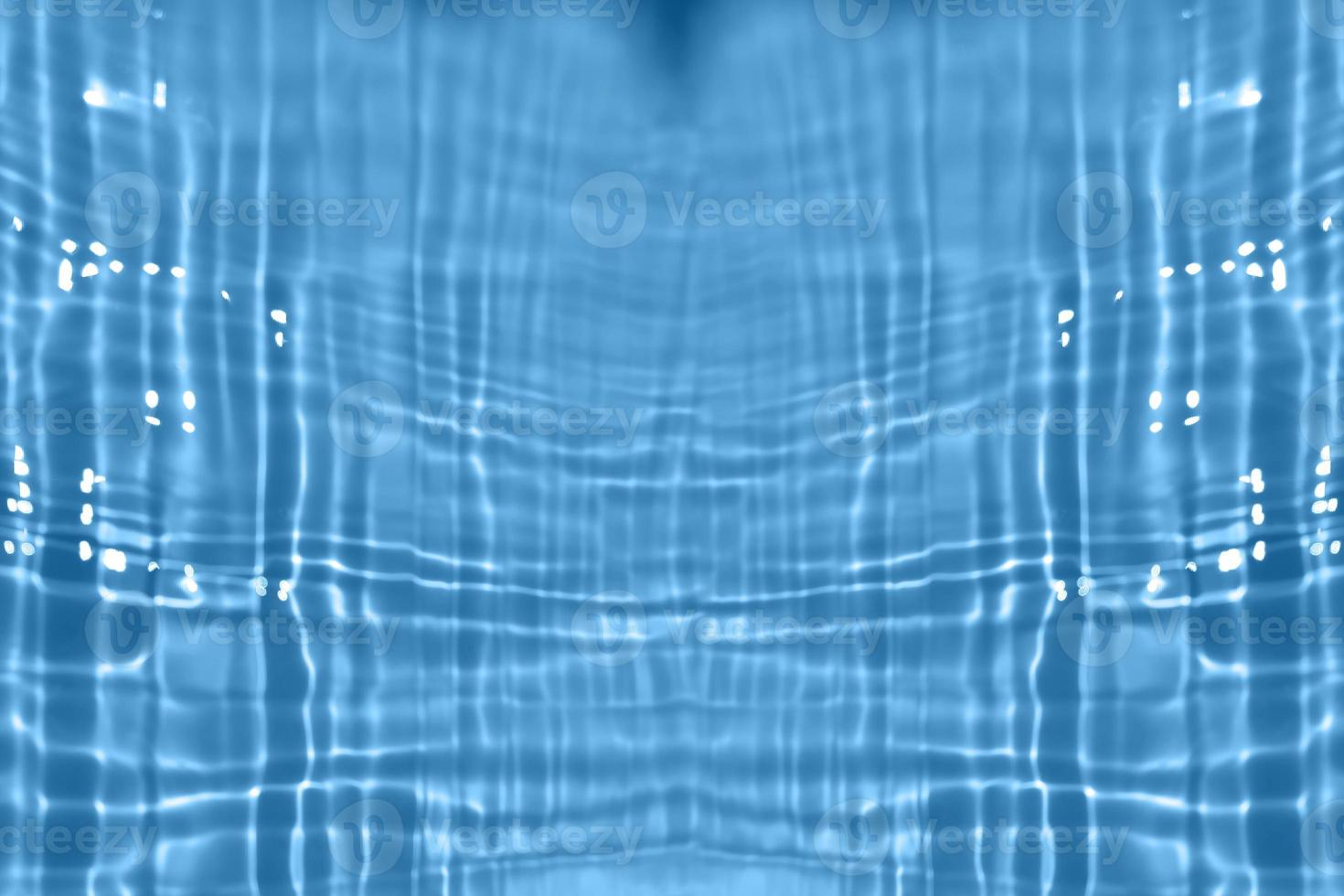 Defocus blurred transparent blue colored clear calm water surface texture with splash, bubble. Shining blue water ripple background. Surface of water in swimming pool. Blue bubble water shining. photo