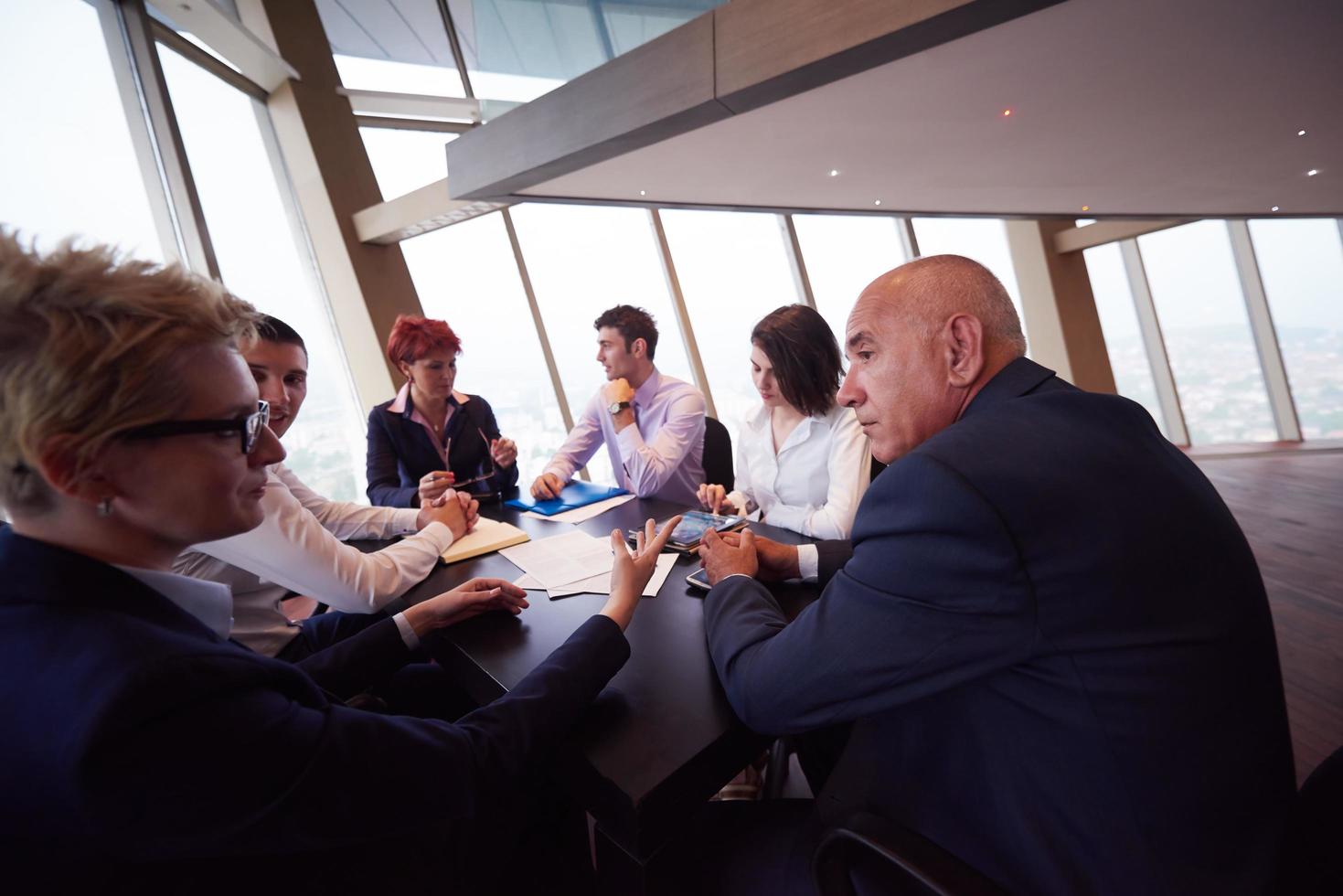 business people group on meeting at modern bright office photo