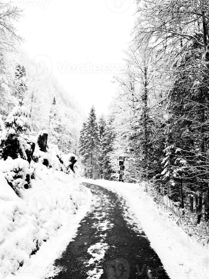 Walkway hiking epic mountain outdoor adventure to the old salt mine of Hallstatt pass the pine forest and Winter snow mountain landscape outdoor adventure, Austria photo