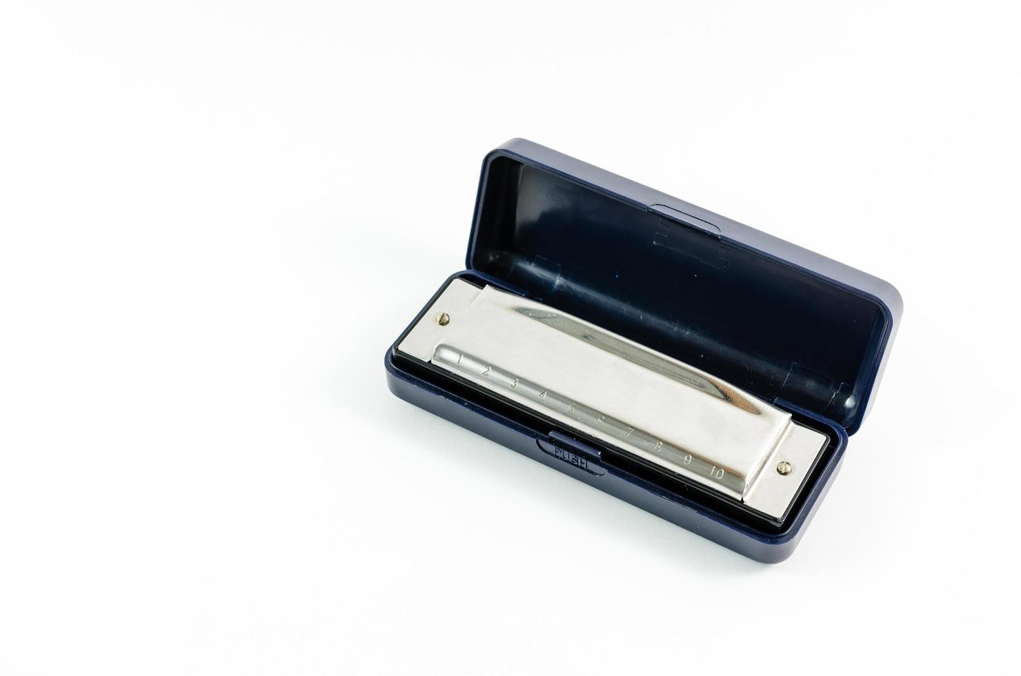 Silver diatonic blues harp photo