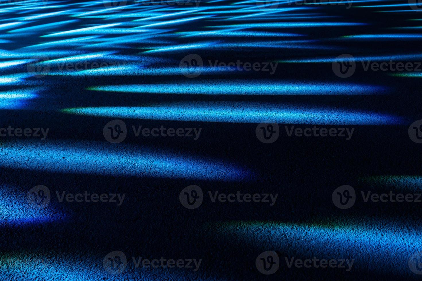 Dramatic multicolored lights on the floor in a disco, stage light show. photo