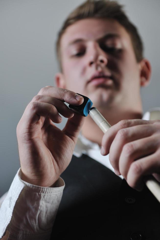 young man play pro billiard game photo