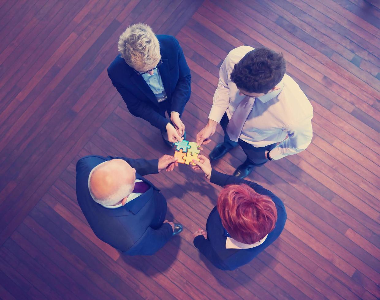 assembling jigsaw puzzle photo