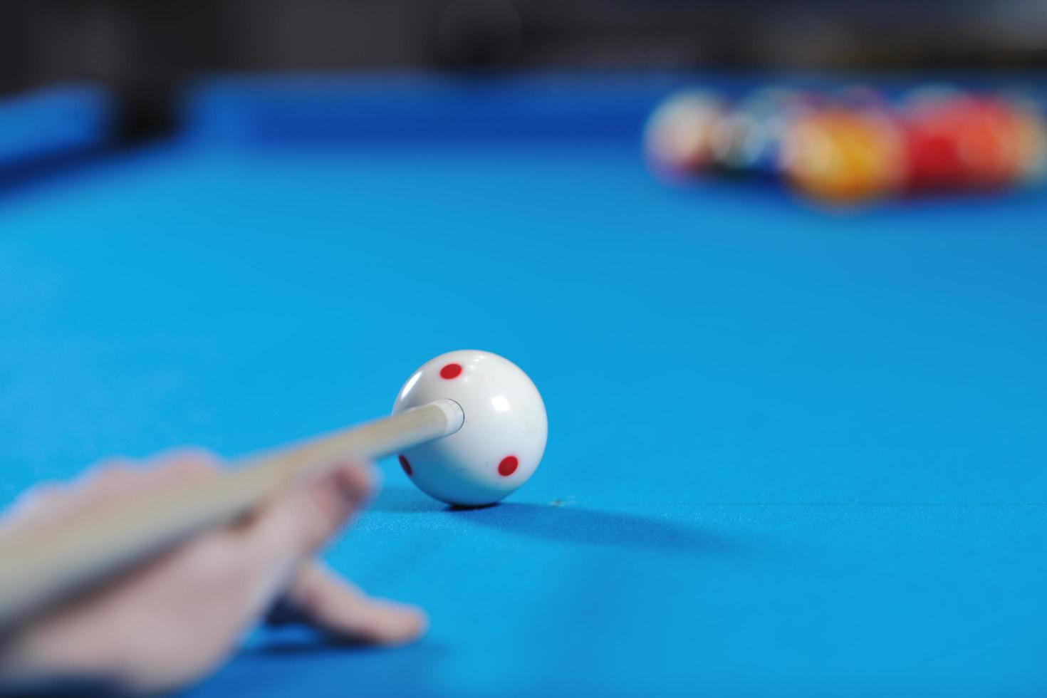 young man play pro billiard game photo