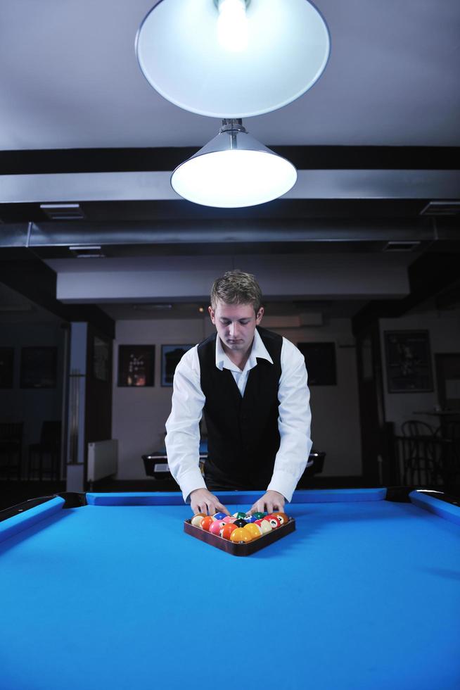 young man play pro billiard game photo