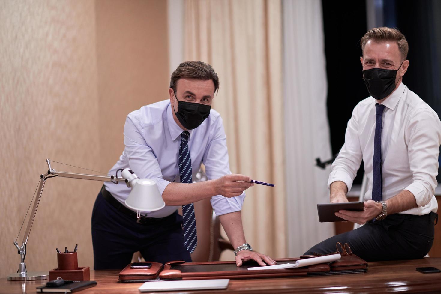 business people wearing crona virus protection face mask on meeting photo