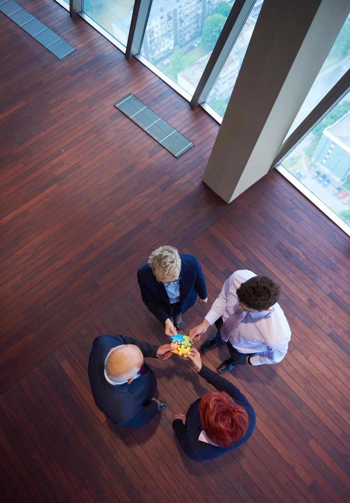 assembling jigsaw puzzle 12506116 Stock Photo at Vecteezy