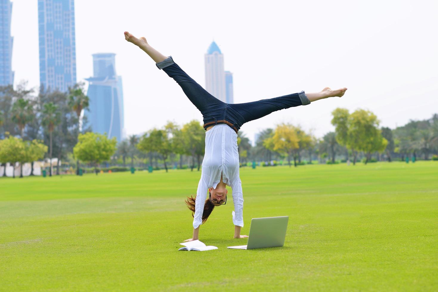 woman with laptop in park photo
