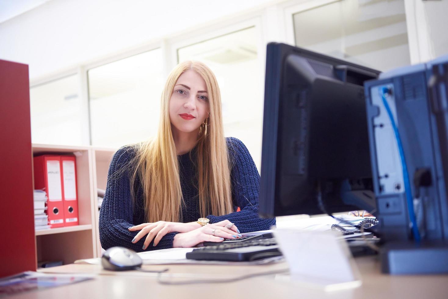 business woman working on computer at office photo