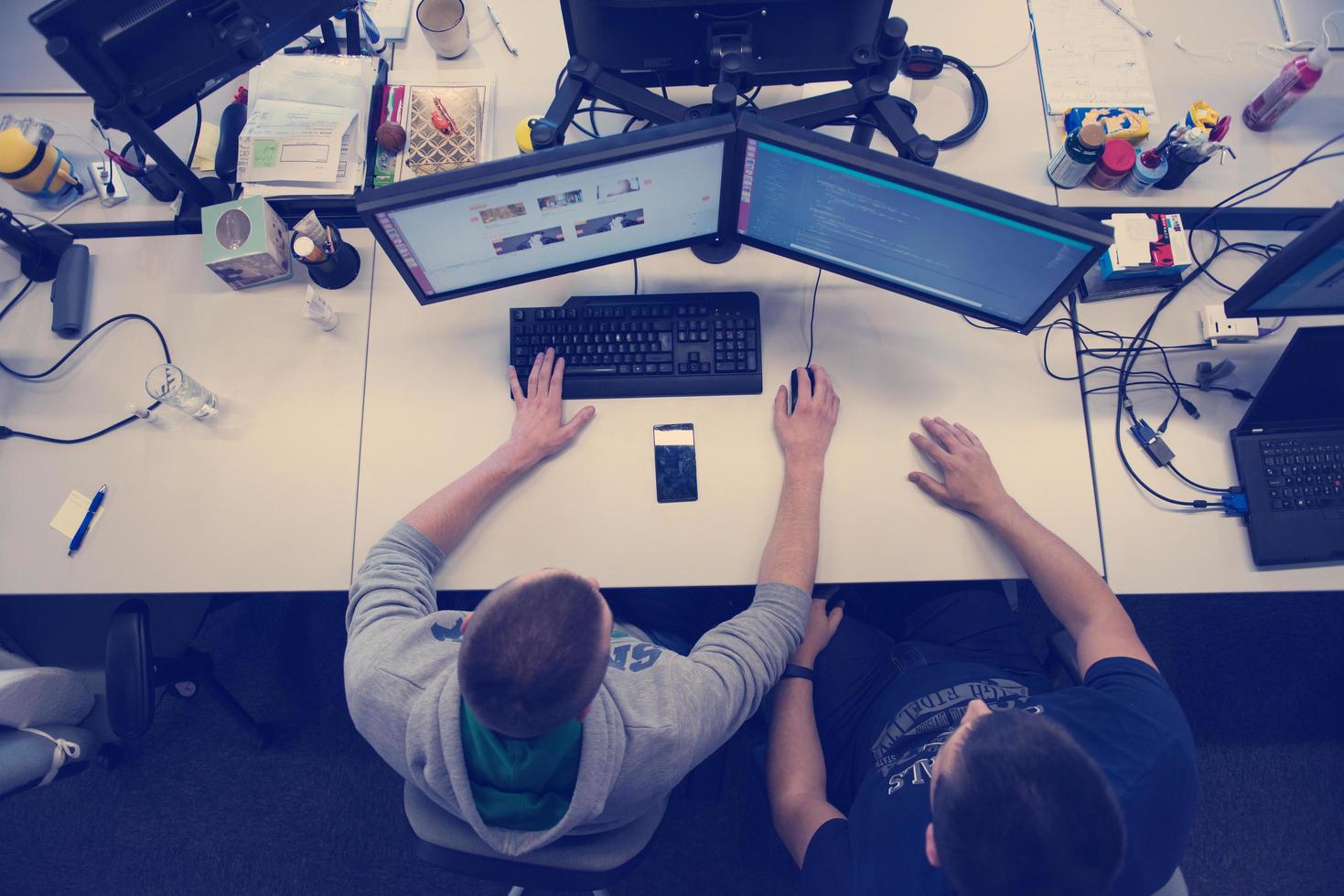 young programmers writing programming code top view photo