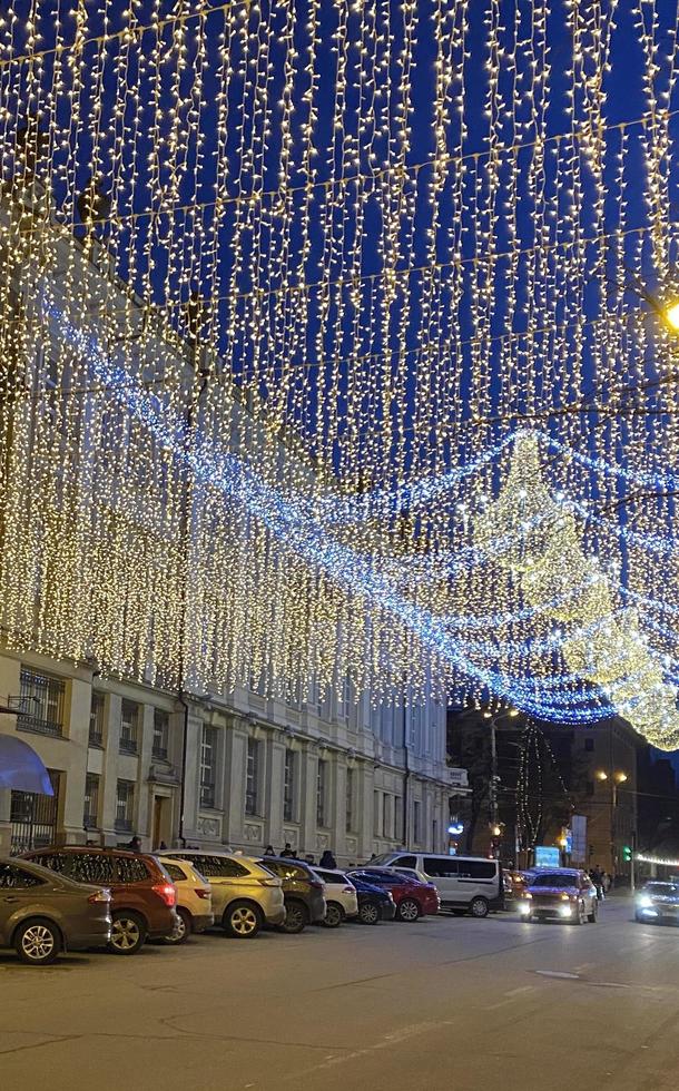Street in city with Christmas lights. photo