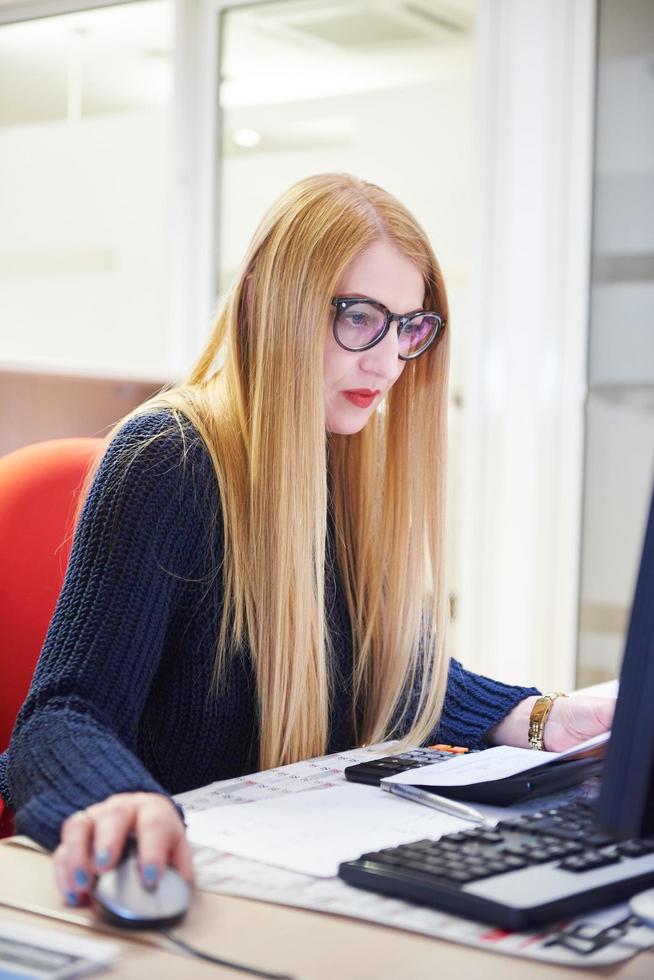 business woman working on computer at office photo