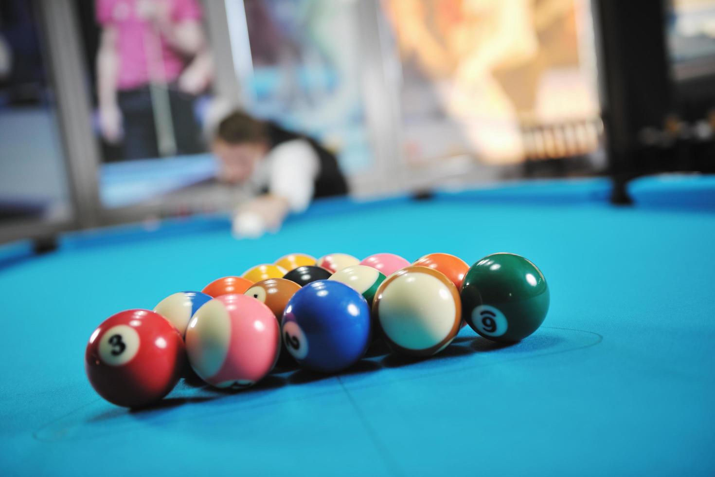 young man play pro billiard game photo