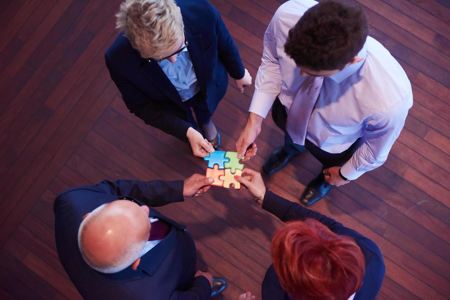 assembling jigsaw puzzle photo