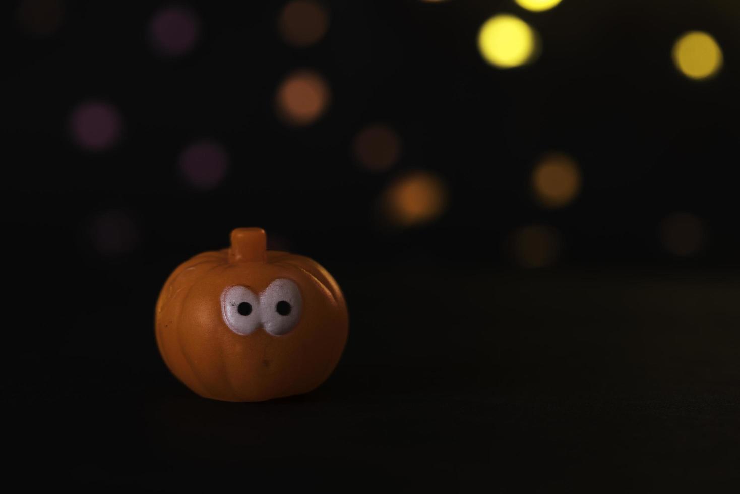 Halloween pumpkin on the black background photo