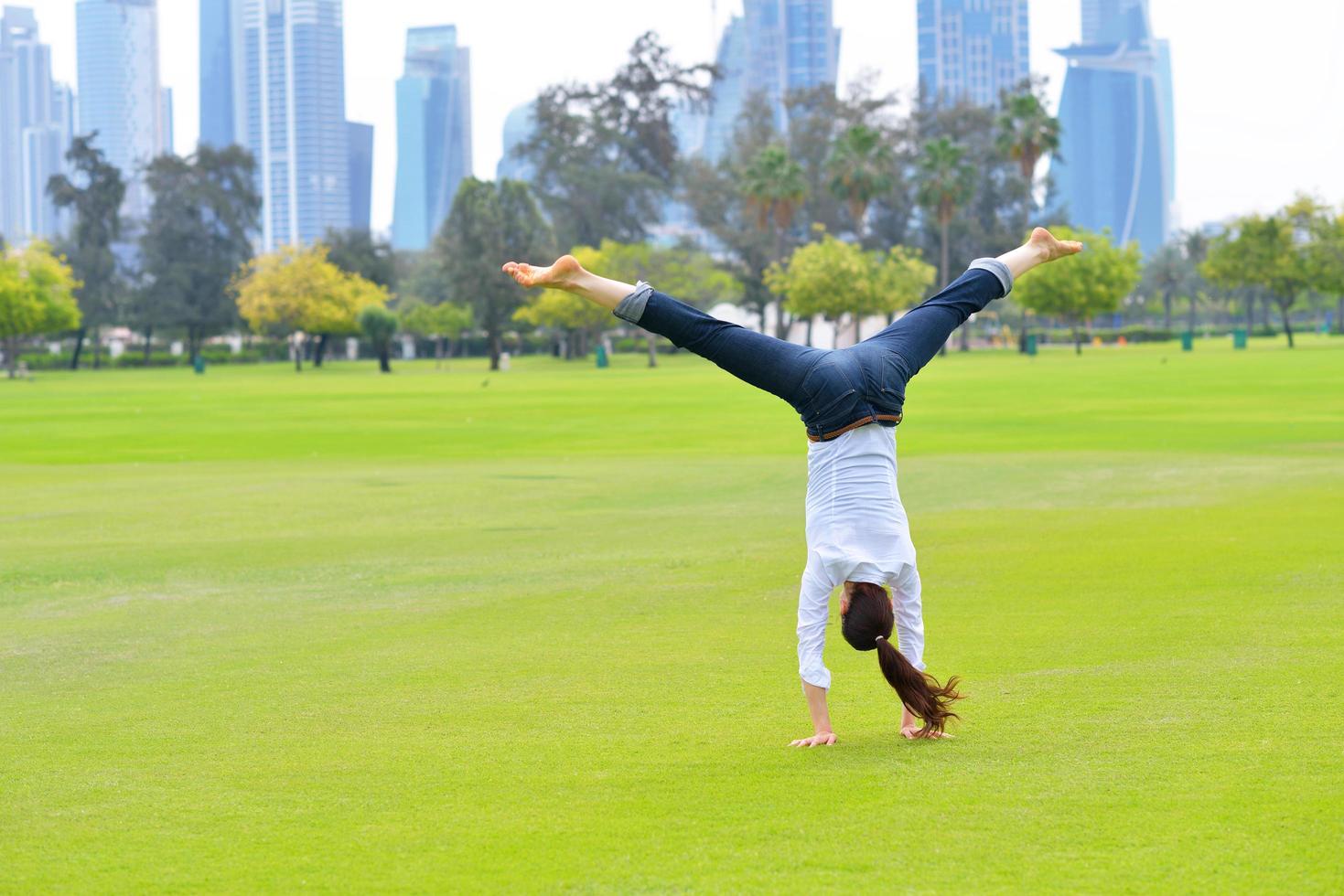 young woman jumping in park photo