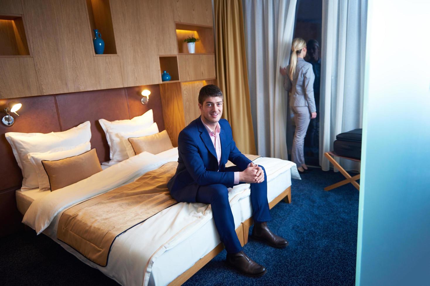 young couple in modern hotel room photo