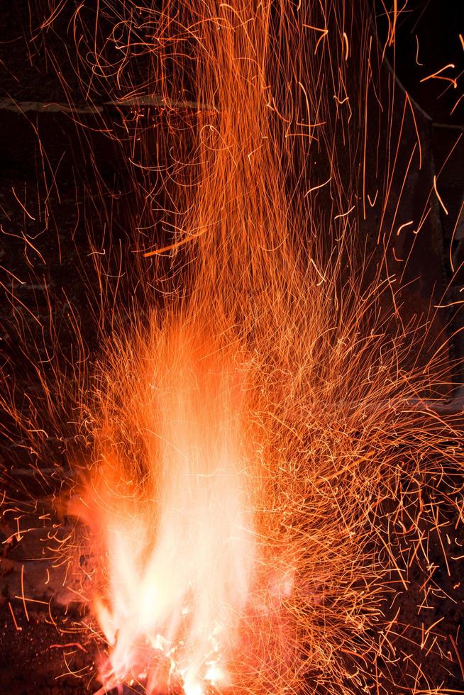 Traditional blacksmith furnace with burning fire photo